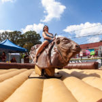 Woman riding mechanical bull